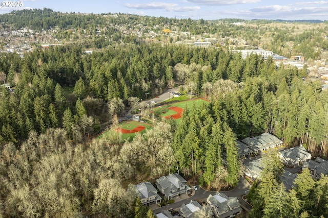 bird's eye view featuring a wooded view