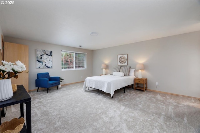 carpeted bedroom with baseboards