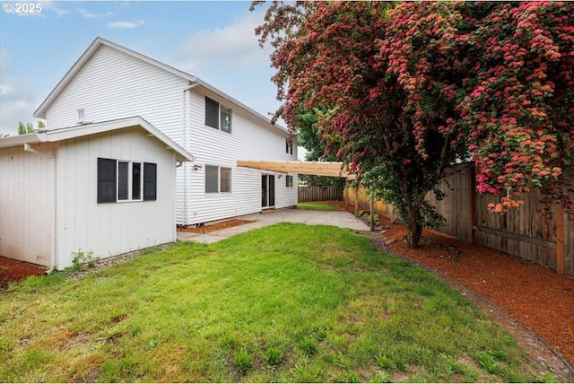 back of house with a patio area