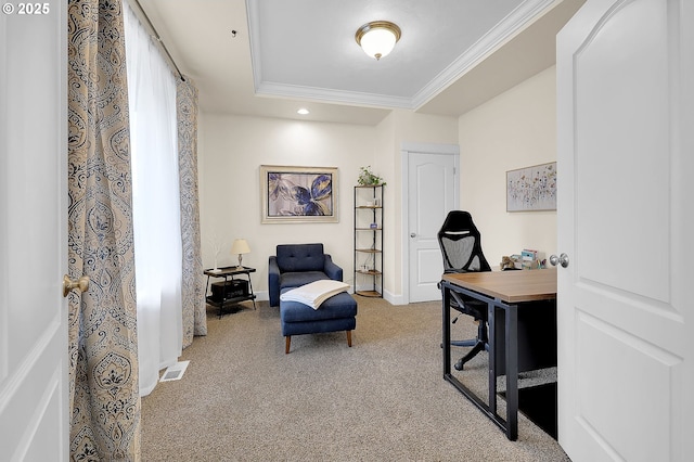 office space with ornamental molding, a raised ceiling, and carpet