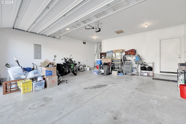 garage featuring a garage door opener and electric panel