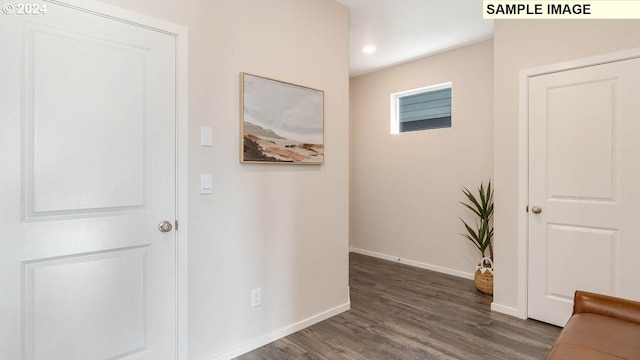 corridor with dark hardwood / wood-style floors