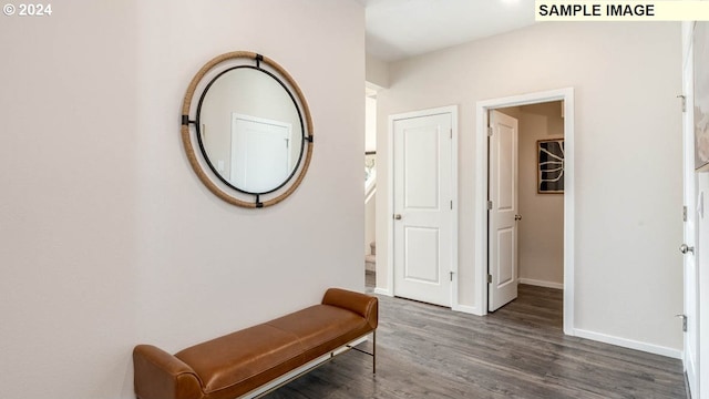 hallway with dark hardwood / wood-style flooring