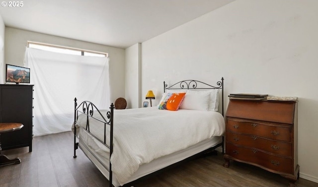 bedroom featuring wood finished floors