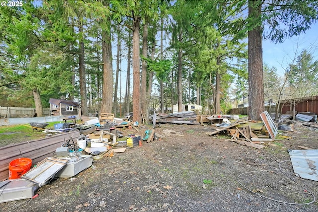 view of yard with an outbuilding and fence