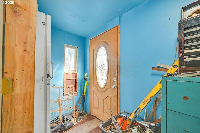 entryway with wood finished floors