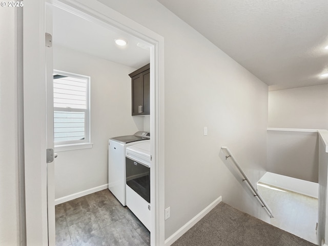 laundry area with independent washer and dryer, baseboards, cabinet space, and recessed lighting