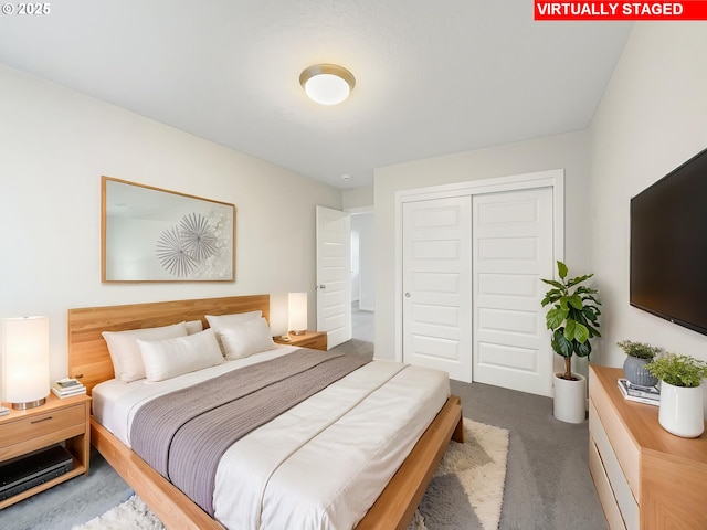 bedroom with a closet and carpet
