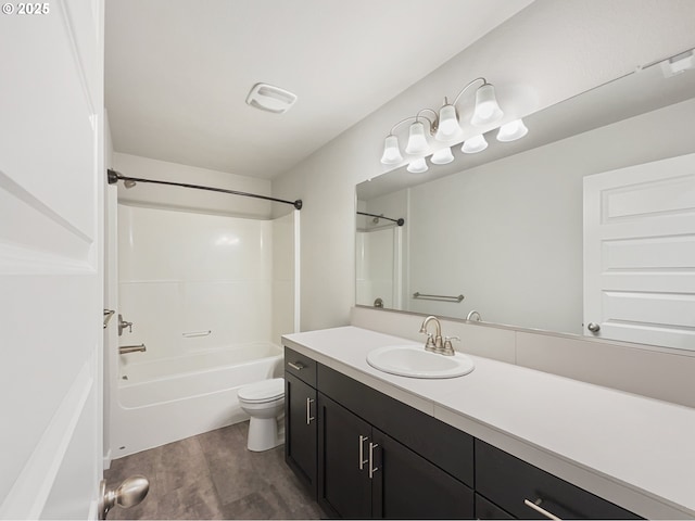 bathroom with tub / shower combination, vanity, toilet, and wood finished floors