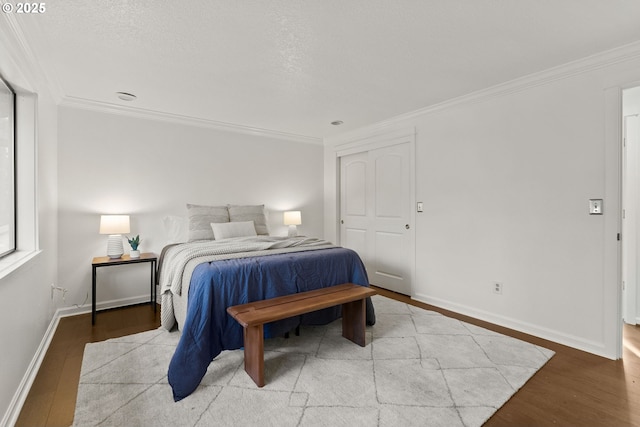 bedroom with light wood-style floors and ornamental molding