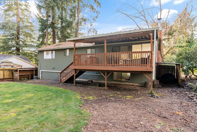 rear view of property featuring stairs, a yard, and a wooden deck