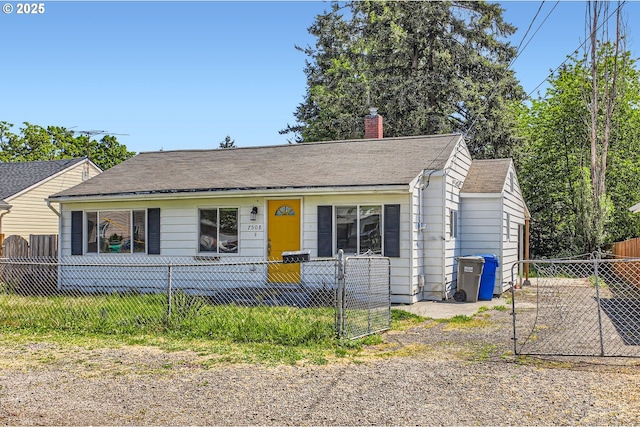 7508 SE Ogden St, Portland, OR 97206 - view of front of property with a chimney, a fenced front yard, a gate, and a shingled roof