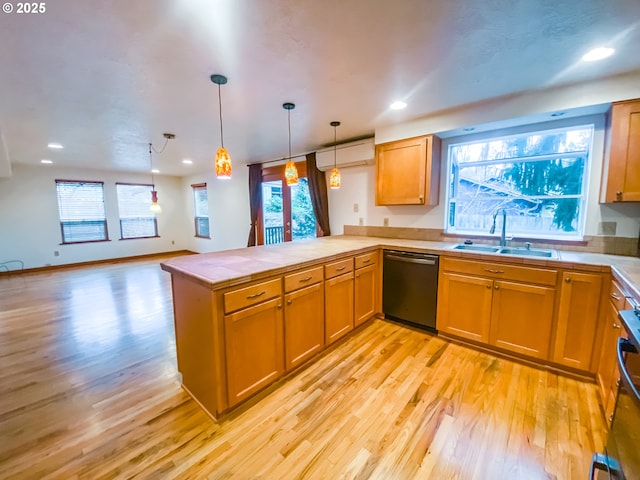 3241 SW Spring Garden St, Portland, OR 97219 - kitchen featuring dishwashing machine, a peninsula, light wood finished floors, pendant lighting, and recessed lighting