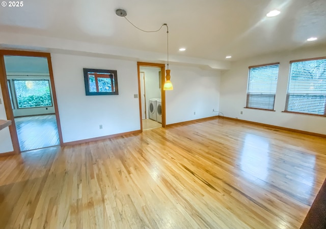 3241 SW Spring Garden St, Portland, OR 97219 - empty room featuring washing machine and clothes dryer, light wood-type flooring, and recessed lighting