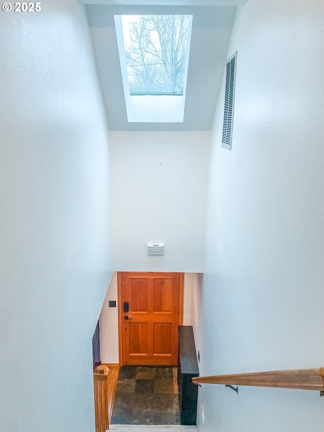 3241 SW Spring Garden St, Portland, OR 97219 - stairway with a skylight and lofted ceiling