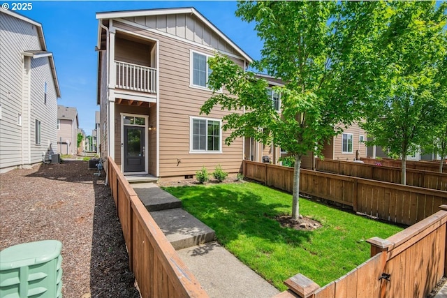 7119 NE 152nd Pl, Vancouver, WA 98682 - back of property featuring board and batten siding, crawl space, a balcony, and central AC unit
