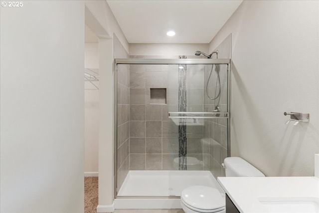 7119 NE 152nd Pl, Vancouver, WA 98682 - bathroom featuring toilet, a stall shower, and vanity