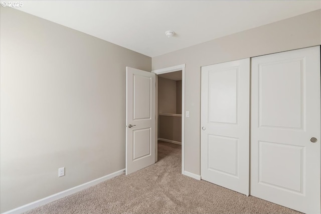 7119 NE 152nd Pl, Vancouver, WA 98682 - unfurnished bedroom featuring light colored carpet, baseboards, and a closet