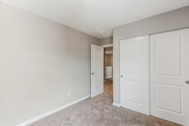 7119 NE 152nd Pl, Vancouver, WA 98682 - unfurnished bedroom featuring light colored carpet, baseboards, and a closet