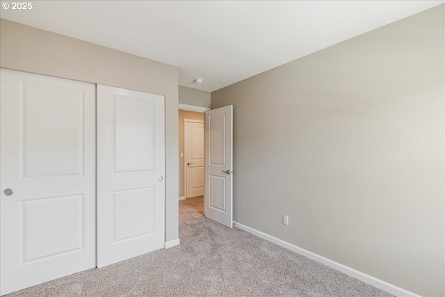 7119 NE 152nd Pl, Vancouver, WA 98682 - unfurnished bedroom featuring light colored carpet, baseboards, and a closet