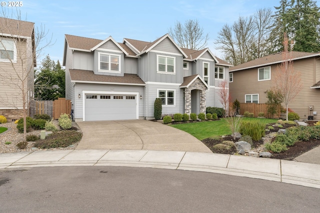 view of front facade featuring concrete driveway, an attached garage, fence, and board and batten siding