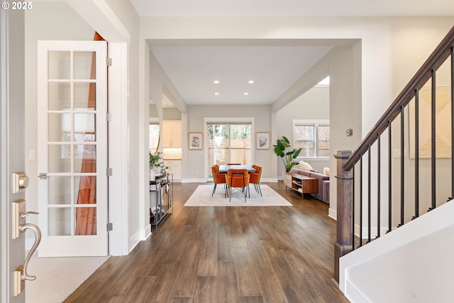 foyer entrance with dark wood-style floors, stairway, recessed lighting, and baseboards