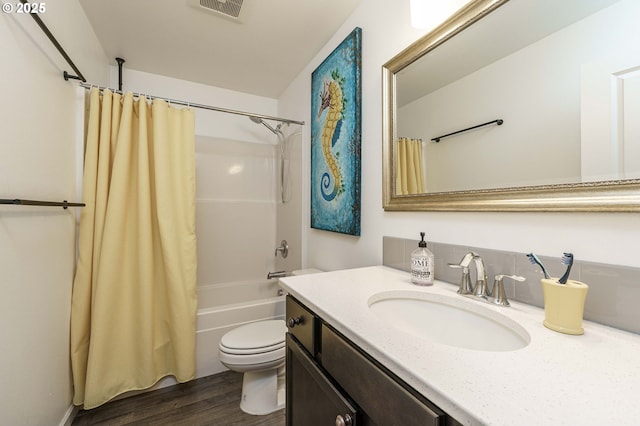 bathroom with vanity, shower / bathtub combination with curtain, wood finished floors, visible vents, and toilet