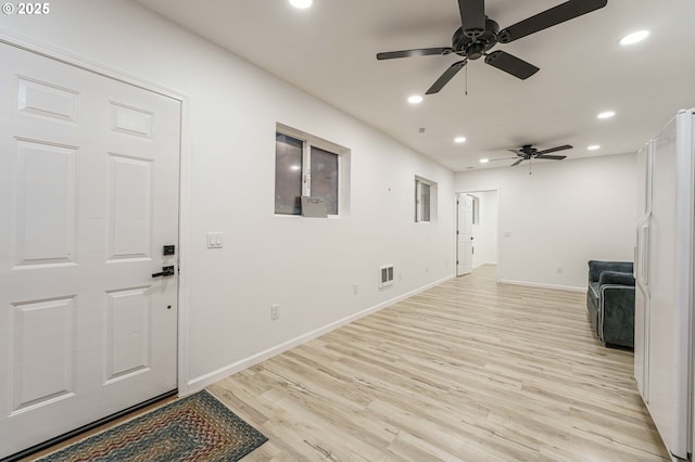 interior space with baseboards, recessed lighting, visible vents, and light wood-type flooring