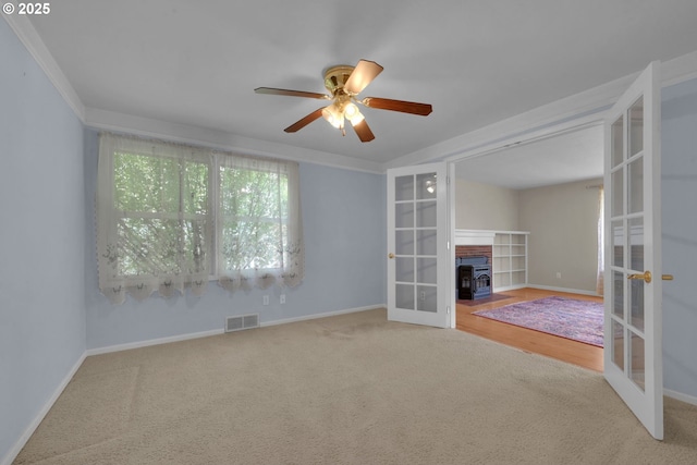 150 Maynard Ave, Eugene, OR 97404 - unfurnished living room featuring french doors, carpet, a ceiling fan, and baseboards