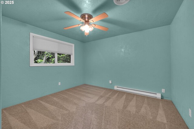 150 Maynard Ave, Eugene, OR 97404 - carpeted empty room with a baseboard radiator and a ceiling fan