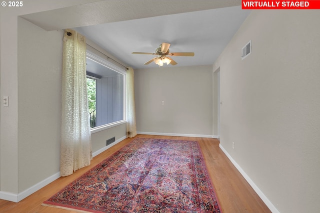 150 Maynard Ave, Eugene, OR 97404 - unfurnished room with wood finished floors, ceiling fan, and baseboards