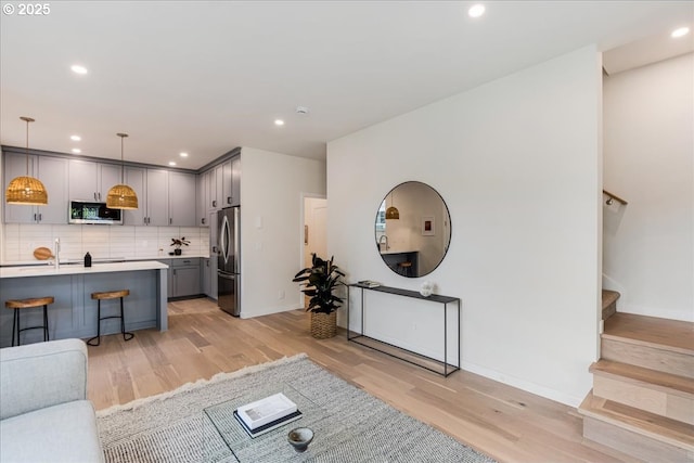 living room with light hardwood / wood-style floors