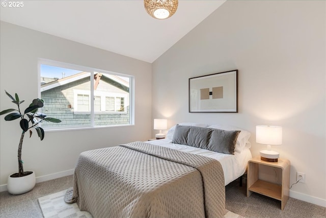 bedroom with light colored carpet and vaulted ceiling