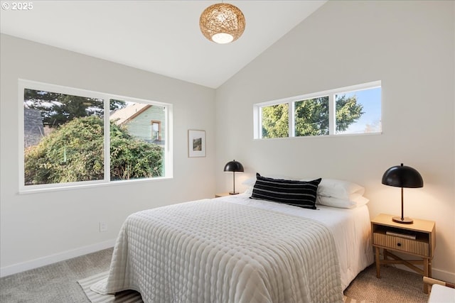 bedroom with carpet and vaulted ceiling