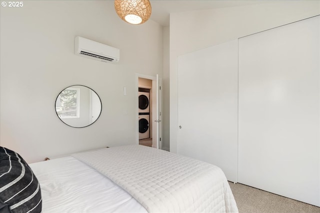 bedroom featuring stacked washer / dryer, carpet floors, and a wall mounted air conditioner