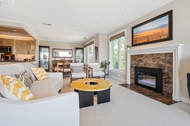 766 NW Westover Sq, Portland, OR 97210 - carpeted living area with recessed lighting, crown molding, and a fireplace