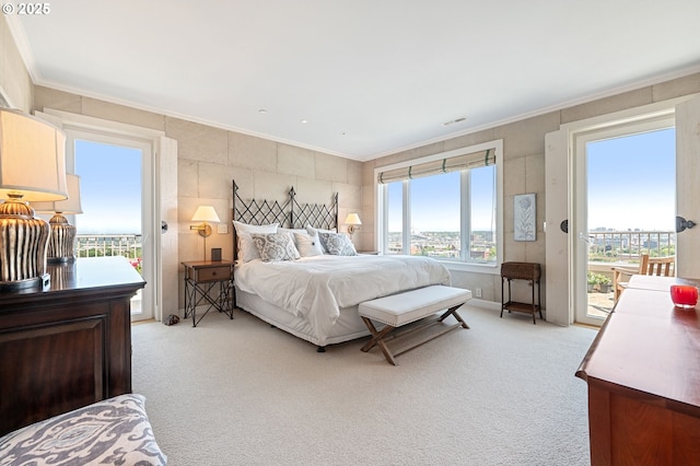 766 NW Westover Sq, Portland, OR 97210 - bedroom with light carpet, access to exterior, and crown molding