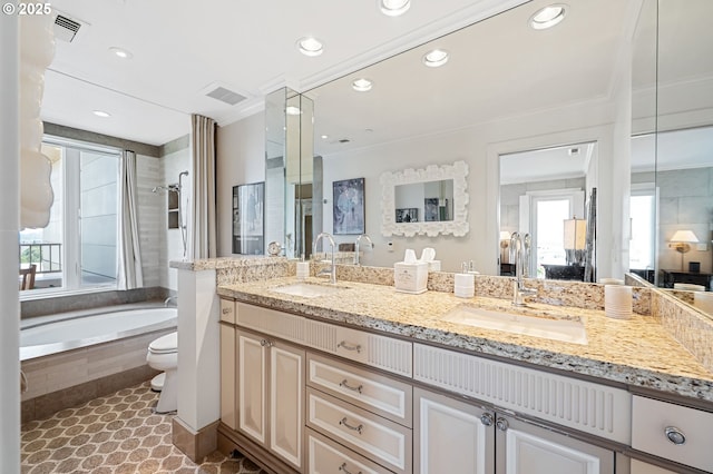 766 NW Westover Sq, Portland, OR 97210 - bathroom with tiled bath, double vanity, crown molding, and recessed lighting