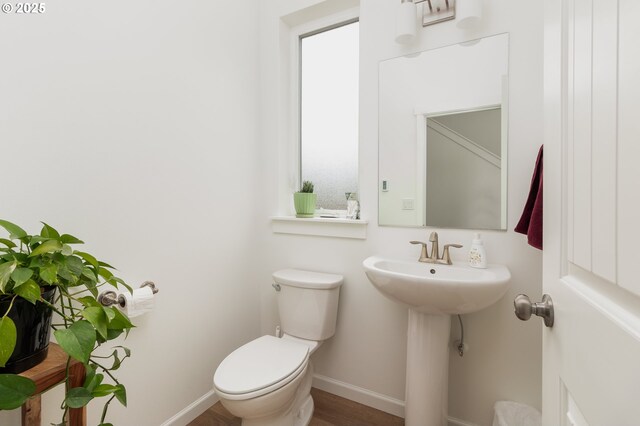 1937 NE 7th Dr, Lincoln City, OR 97367 - half bath featuring toilet, baseboards, and wood finished floors