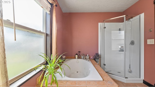 468 E Sunset Dr, Hermiston, OR 97838 - bathroom with a shower stall, a jetted tub, and a textured ceiling