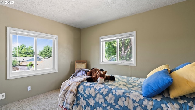 468 E Sunset Dr, Hermiston, OR 97838 - bedroom featuring carpet floors and a textured ceiling