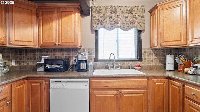 468 E Sunset Dr, Hermiston, OR 97838 - kitchen with white dishwasher, backsplash, and brown cabinetry