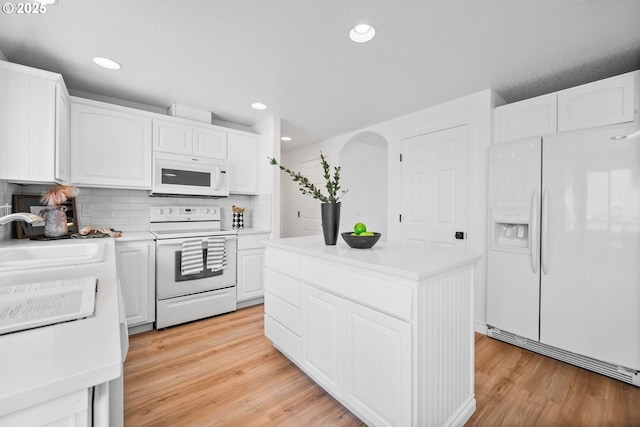 2952 NW Ogden St, Camas, WA 98607 - kitchen featuring white appliances, a sink, tasteful backsplash, white cabinets, and light countertops