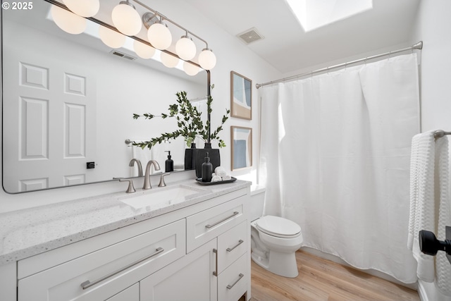 2952 NW Ogden St, Camas, WA 98607 - full bathroom featuring vanity, wood finished floors, toilet, and a shower with shower curtain