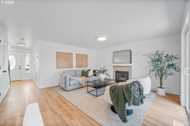 2952 NW Ogden St, Camas, WA 98607 - living area with light wood-style floors, a fireplace, and baseboards