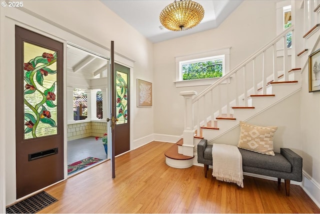 1520 SE 54th Ave, Portland, OR 97215 - foyer with wood finished floors, stairs, and baseboards