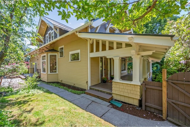 1520 SE 54th Ave, Portland, OR 97215 - view of home's exterior with a gate and covered porch