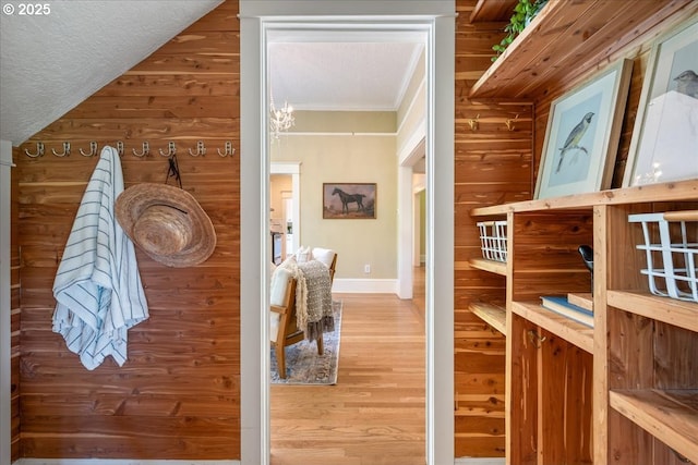 1520 SE 54th Ave, Portland, OR 97215 - hallway featuring wood finished floors, baseboards, wooden walls, and crown molding