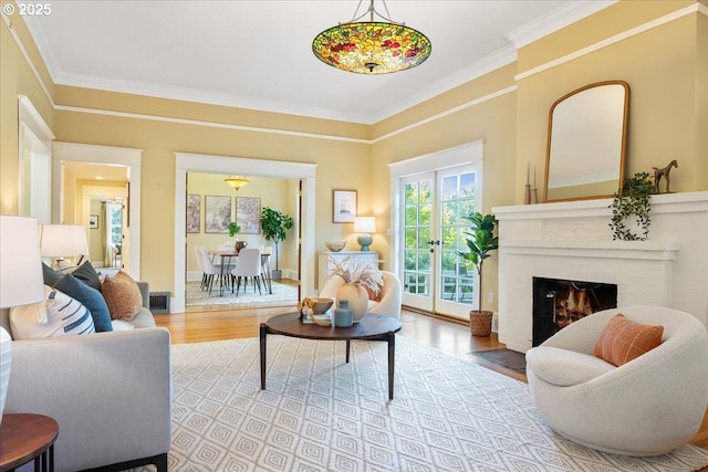 1520 SE 54th Ave, Portland, OR 97215 - living room with a fireplace, wood finished floors, and ornamental molding