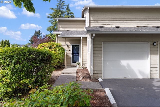 29460 SW Volley St Unit 72, Wilsonville, OR 97070 - view of front of home featuring a garage and roof with shingles
